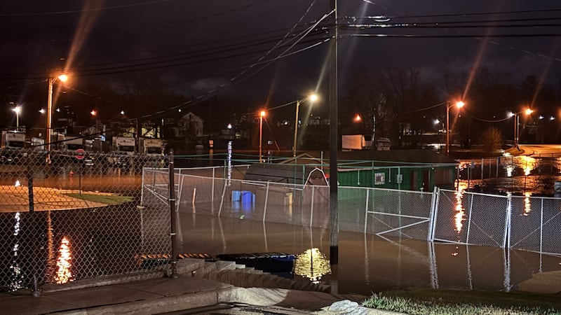 Flooded streets in Clintonville, seen from a parking lot on higher ground