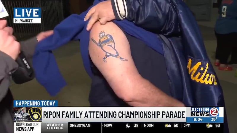 Ripon man shows off his Barrel Man tattoo while waiting with his family for the Milwaukee...