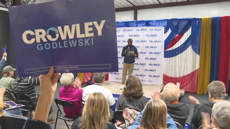 David Crowley talks to supporters in Schofield as part of his 10-day bus tour