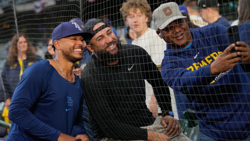 Tampa Bay Rays pitcher Freddy Peralta takes a photo with fans prior to Game 2 of baseball's...