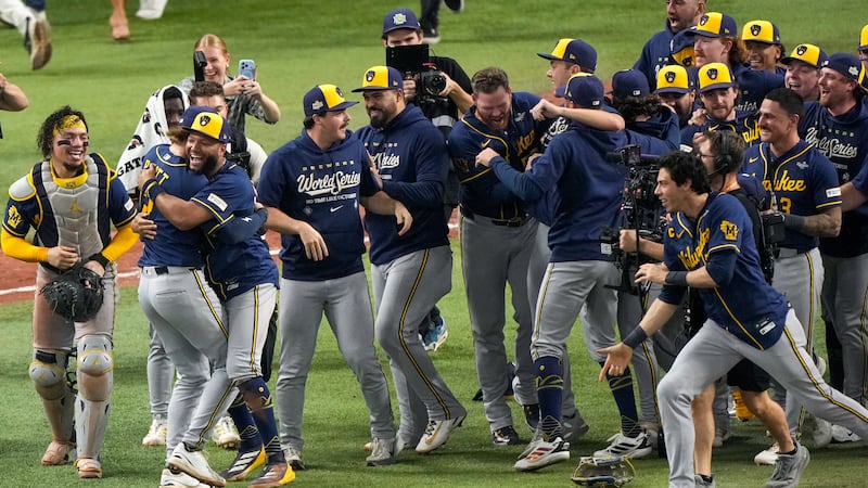 Milwaukee Brewers players celebrate after winning baseball's World Series, against the Tampa...