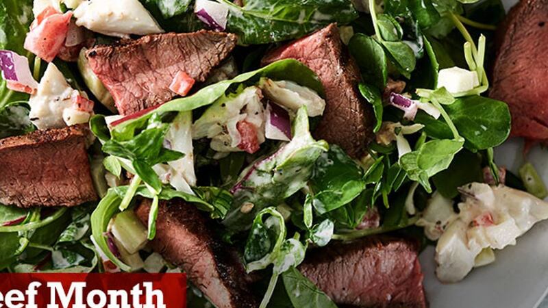 Enjoy a delicious surf and turf salad. Beef Flat Iron steak with Cajun seasoning is grilled...