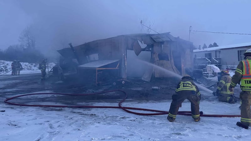 Structure a total loss following fire in snowstorm.